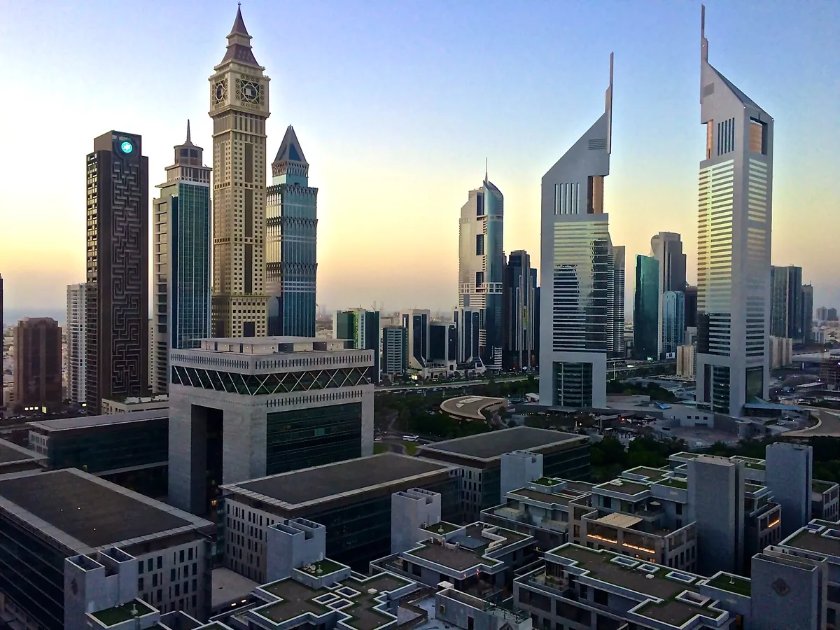 The Gate building at DIFC with Emirates Towers at dawn, Dubai
