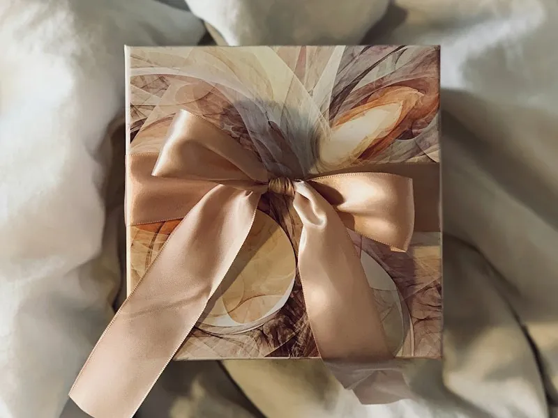 Gift box wrapped with a satin ribbon